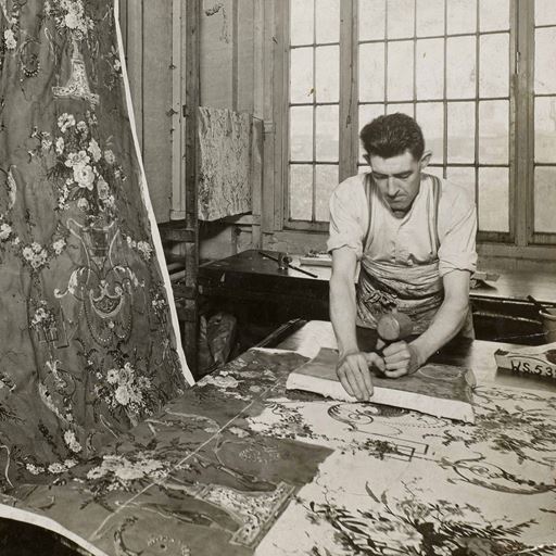 A Warner and Sons employee hand-prints the ‘Directorie’ fabric at the Dartford Print Works c.1930. Image courtesy Warner Textile Archive