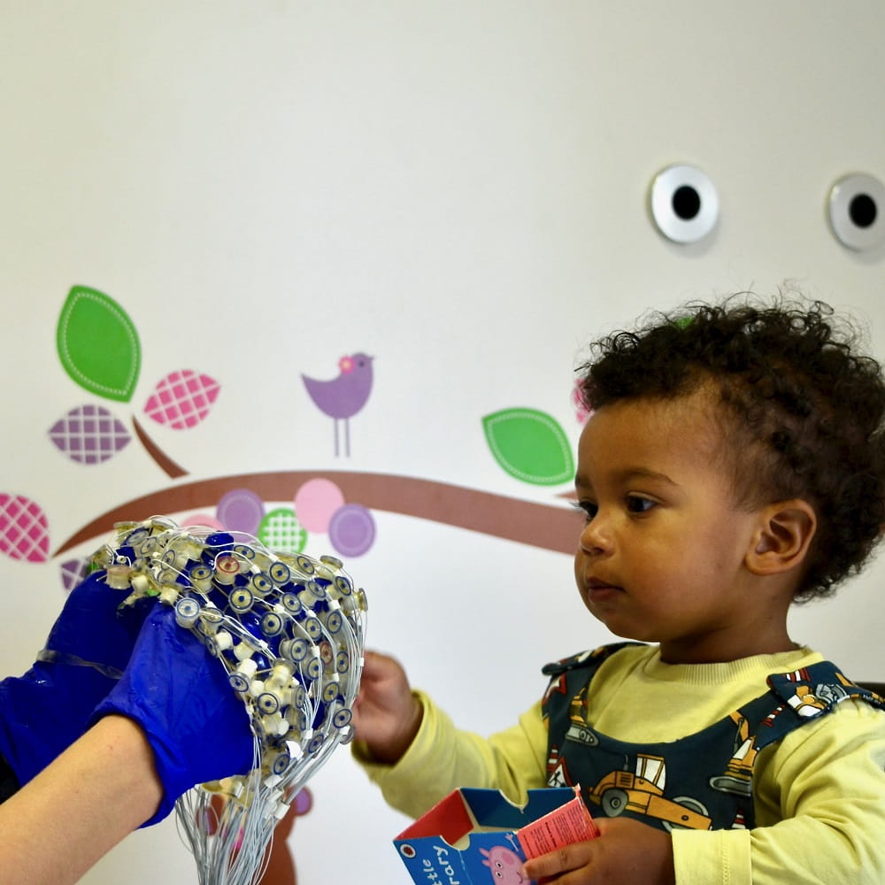 Baby taking part in EEG study