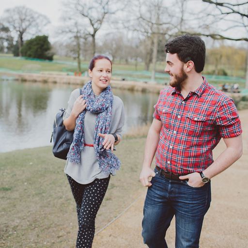 Two students walking by the lake at Colchester campus