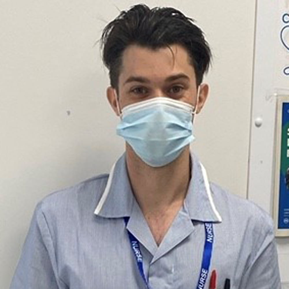 Lewis Reed wearing face mask