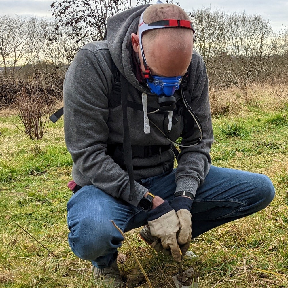 A participant in the study plants a bulb