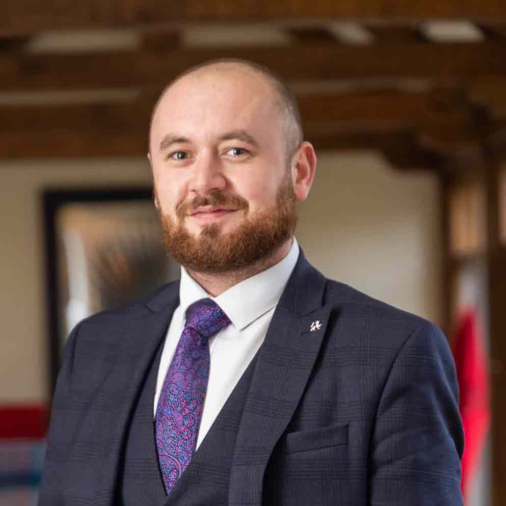 Oliver Harris looking relaxed and smiling slightly