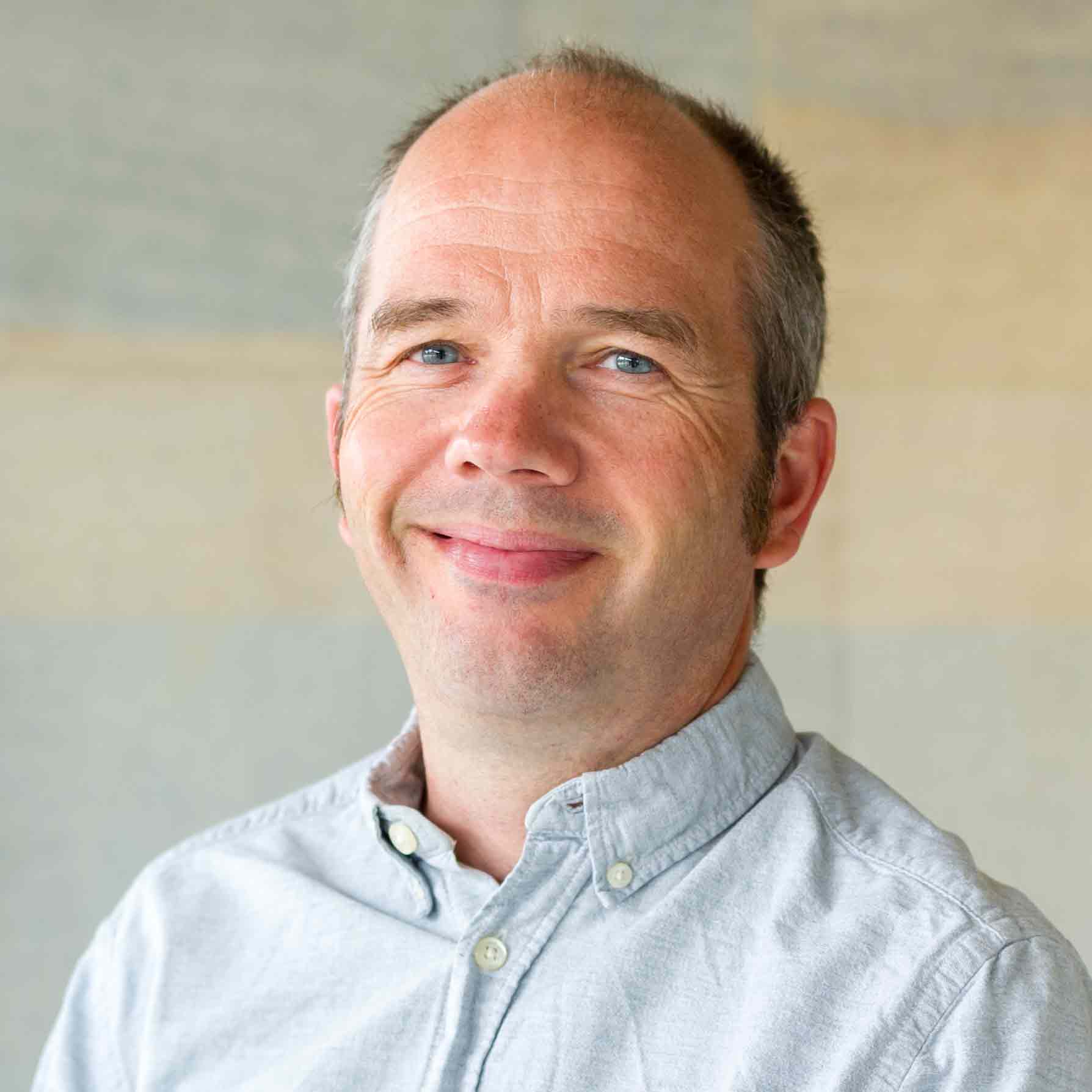 Professor Ewen Speed, smiling and looking relaxed 