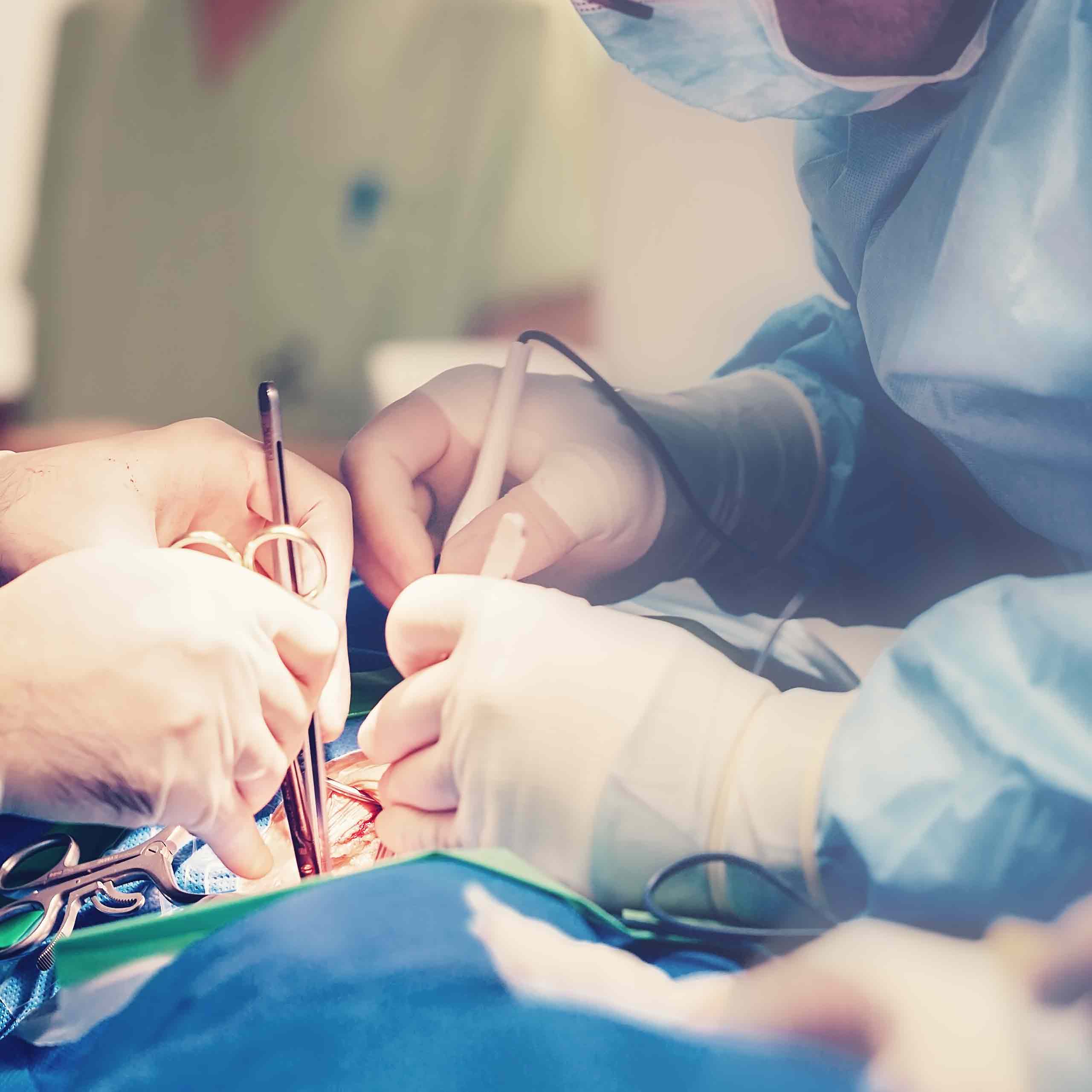 A close-up of surgeons' hands during an operation