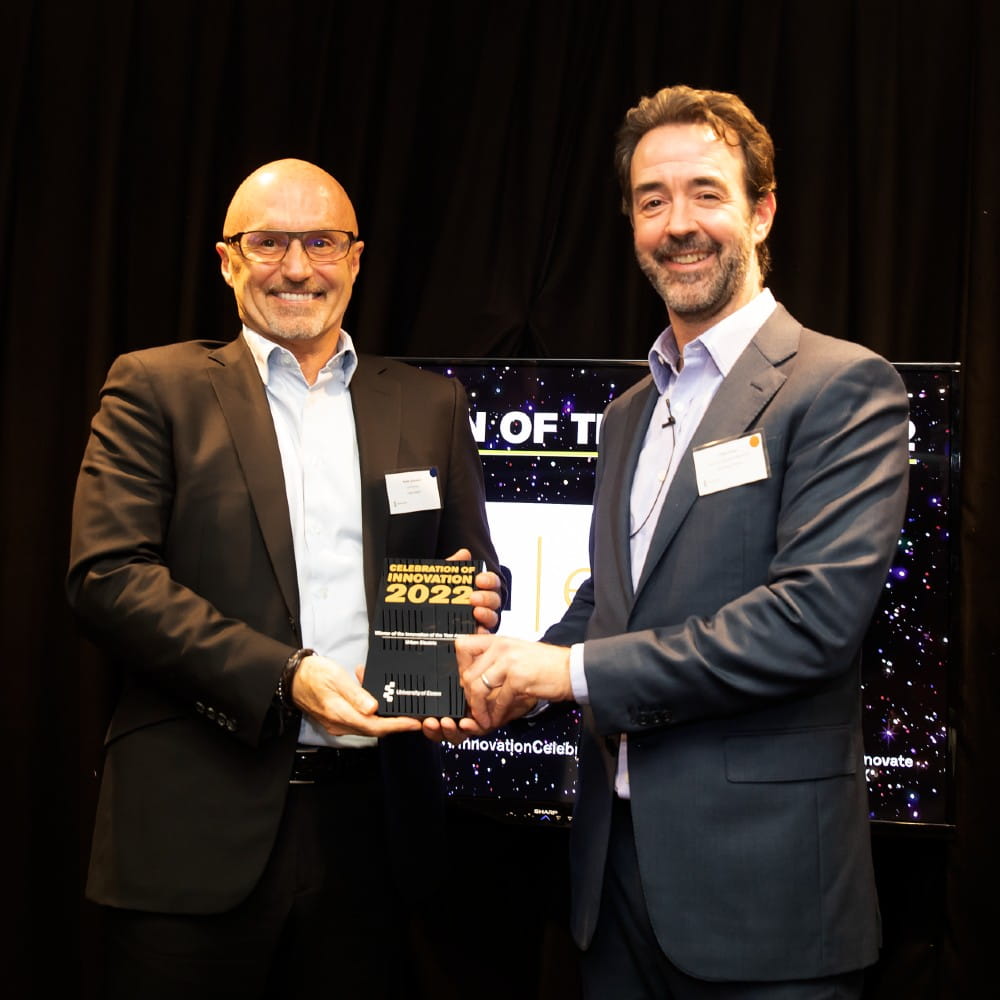 Keith Johnson receives award from Chris Greer