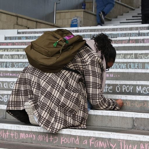 A student taking part in Chalking of the Steps 2022