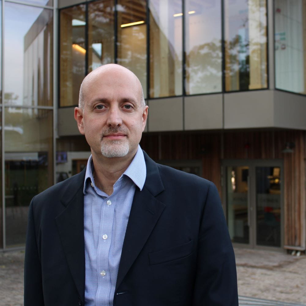 Portrait image of Professor Franco Fiordelisi standing outside Essex Business School