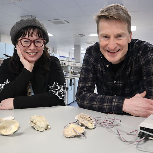 BorokaBoroka Bo and Michael Steinke leaning on lab bench with oysters