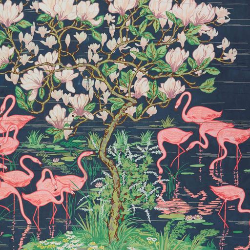 Pink flamingos seen wading in dark blue water amid beautiful white flowers and green foliage