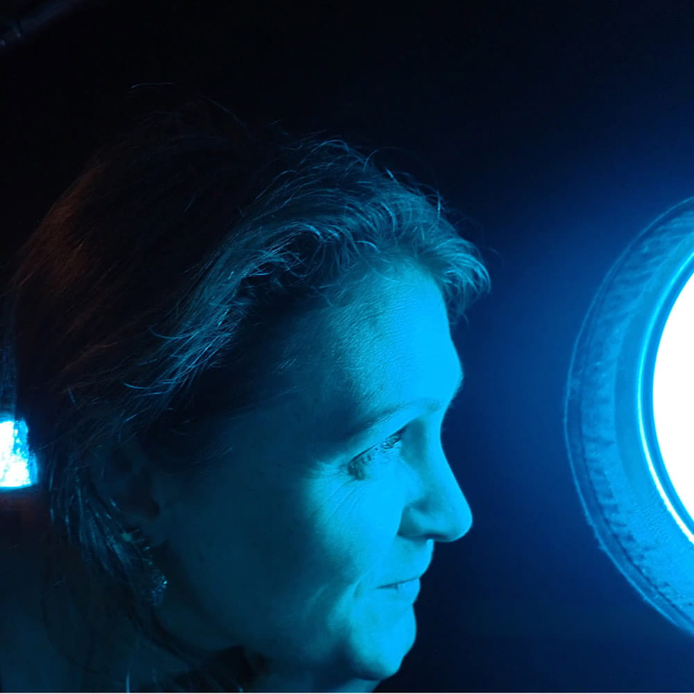Michelle Taylor looking out of a porthole