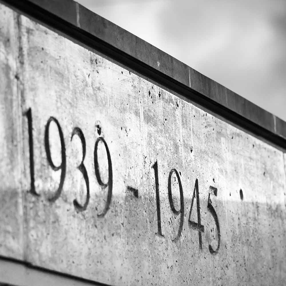 Black and white close up of the dates 1939-1945 on a Second World War Memorial
