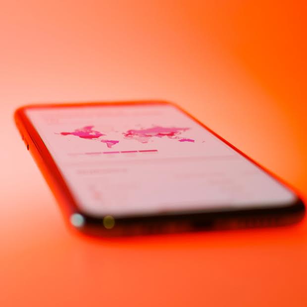 Photo of a mobile phone with a map on it