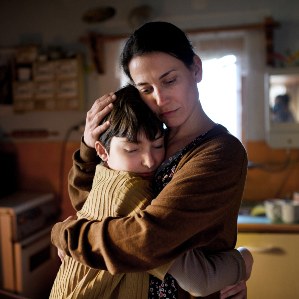 A mother hugging her son