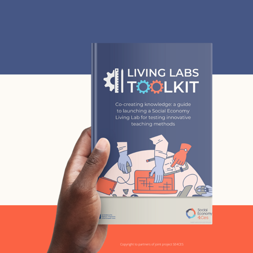 Image of a hand holding a book (the book is called the Living Labs Toolkit)