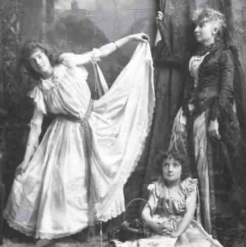 Archive image of two women, and a young girl, theatrically dressed and posing