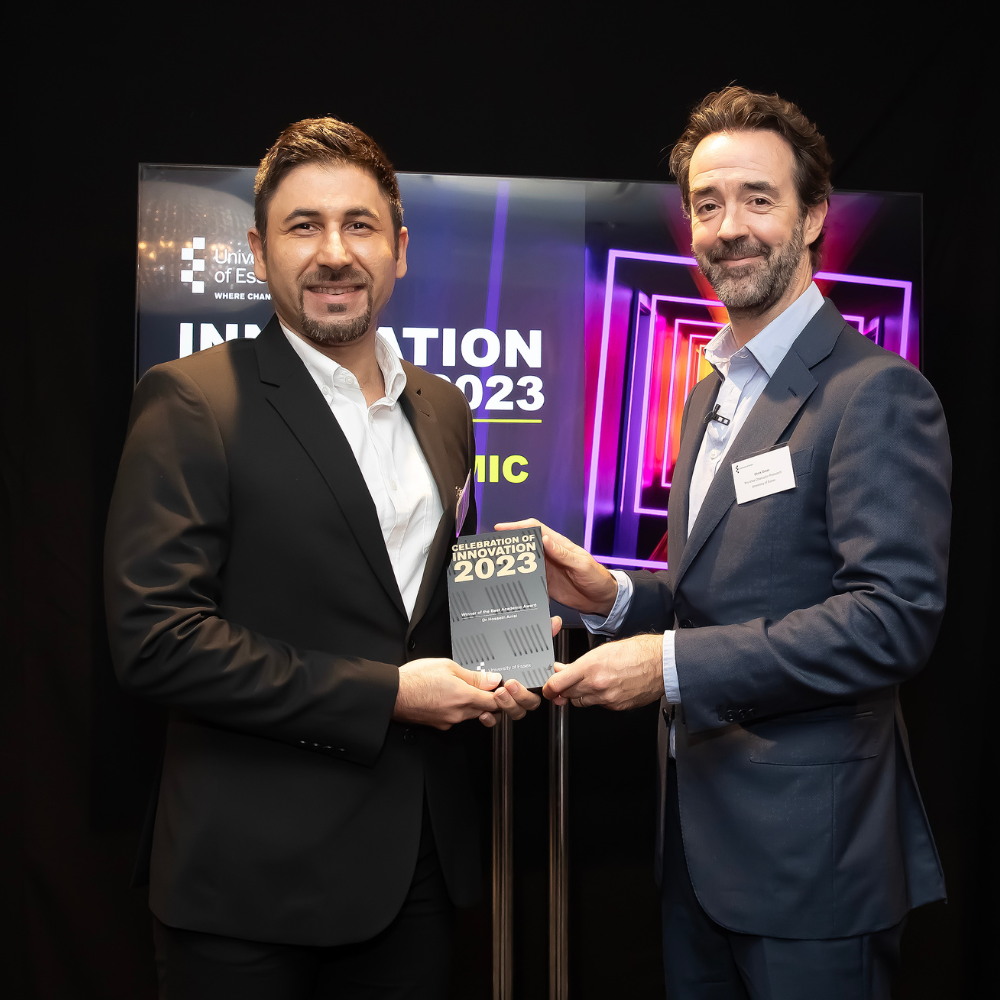 Dr Hossein Anisi collecting his award from Pro-Vice-Chancellor, Research, Professor Chris Greer