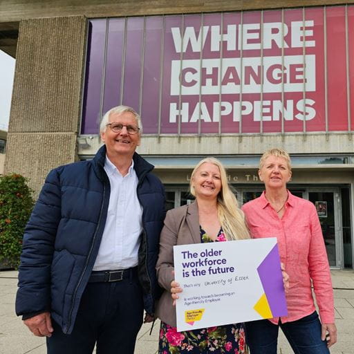 Dr Peter Hall, Professor Maria Fasli and Dr Mary Kennedy holding a hard copy of the University's Age-friendly Employer pledge