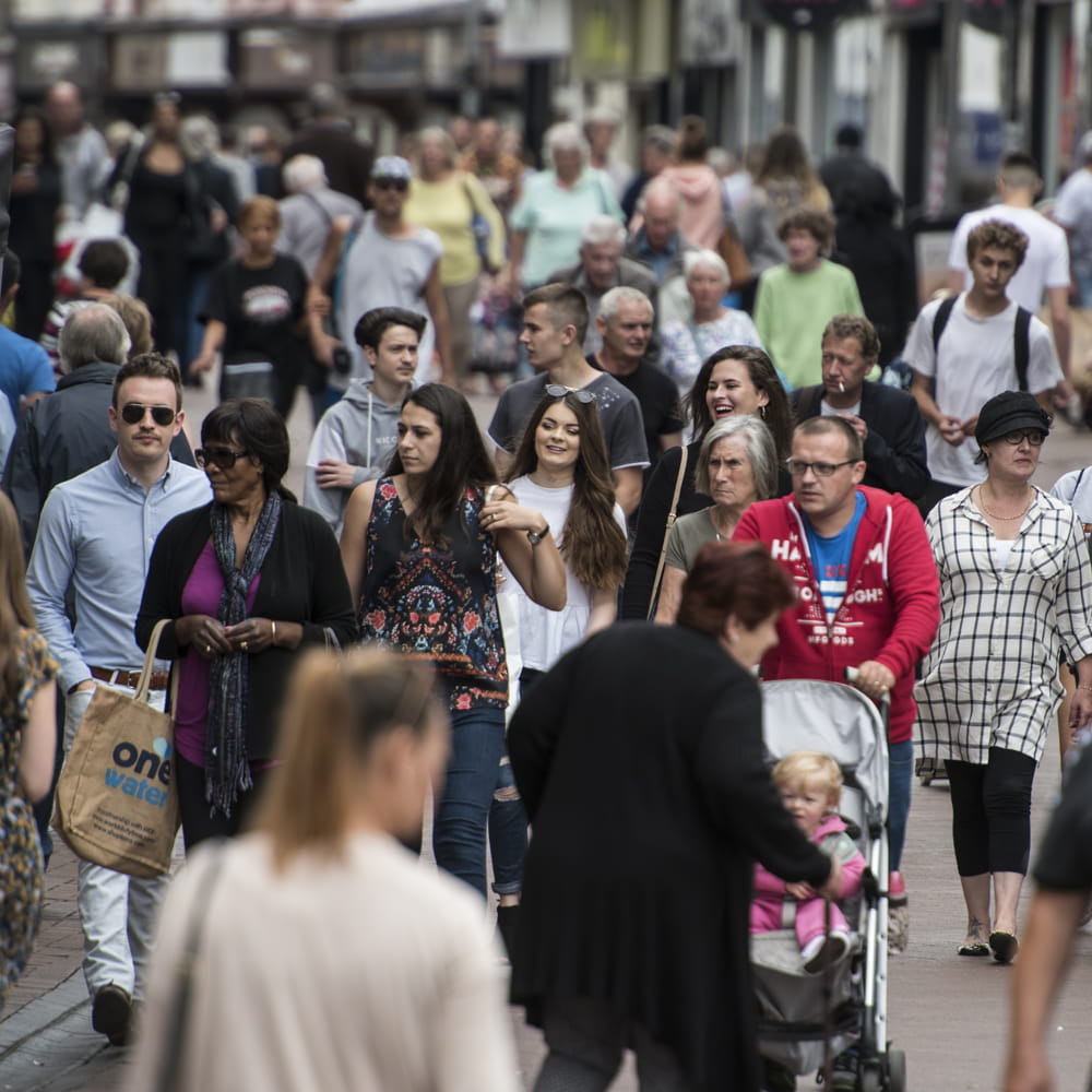 people walking in a town centre
