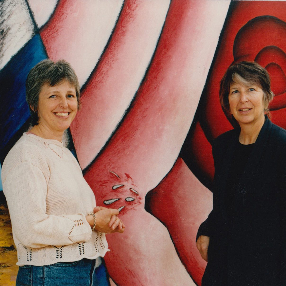 Professors Dawn Ades and Valerie Fraser with artwork from ESCALA
