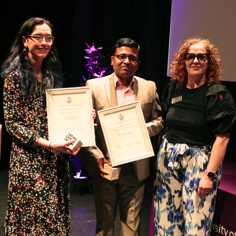 Award winners with certificates at the Excellence in Education Awards 2023