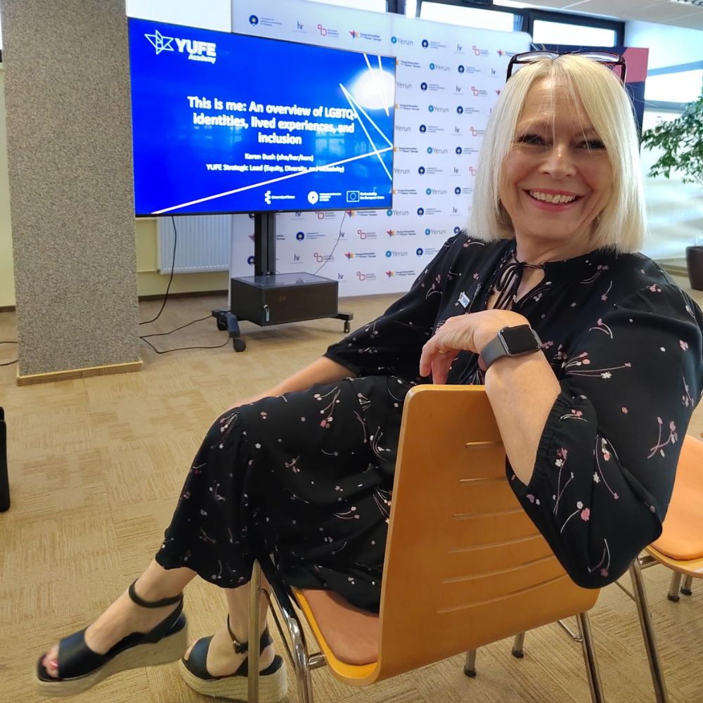 Karen Bush sitting on a chair