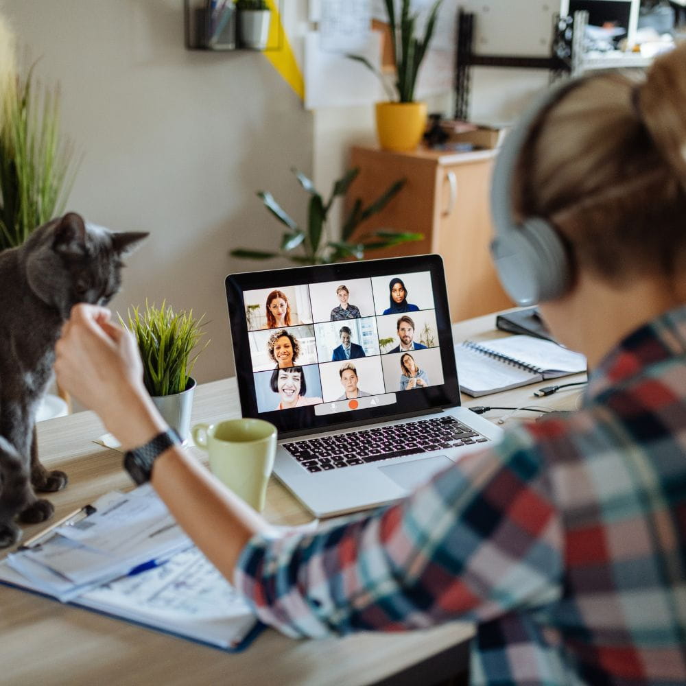 Woman working from home on a zoom call with colleagues