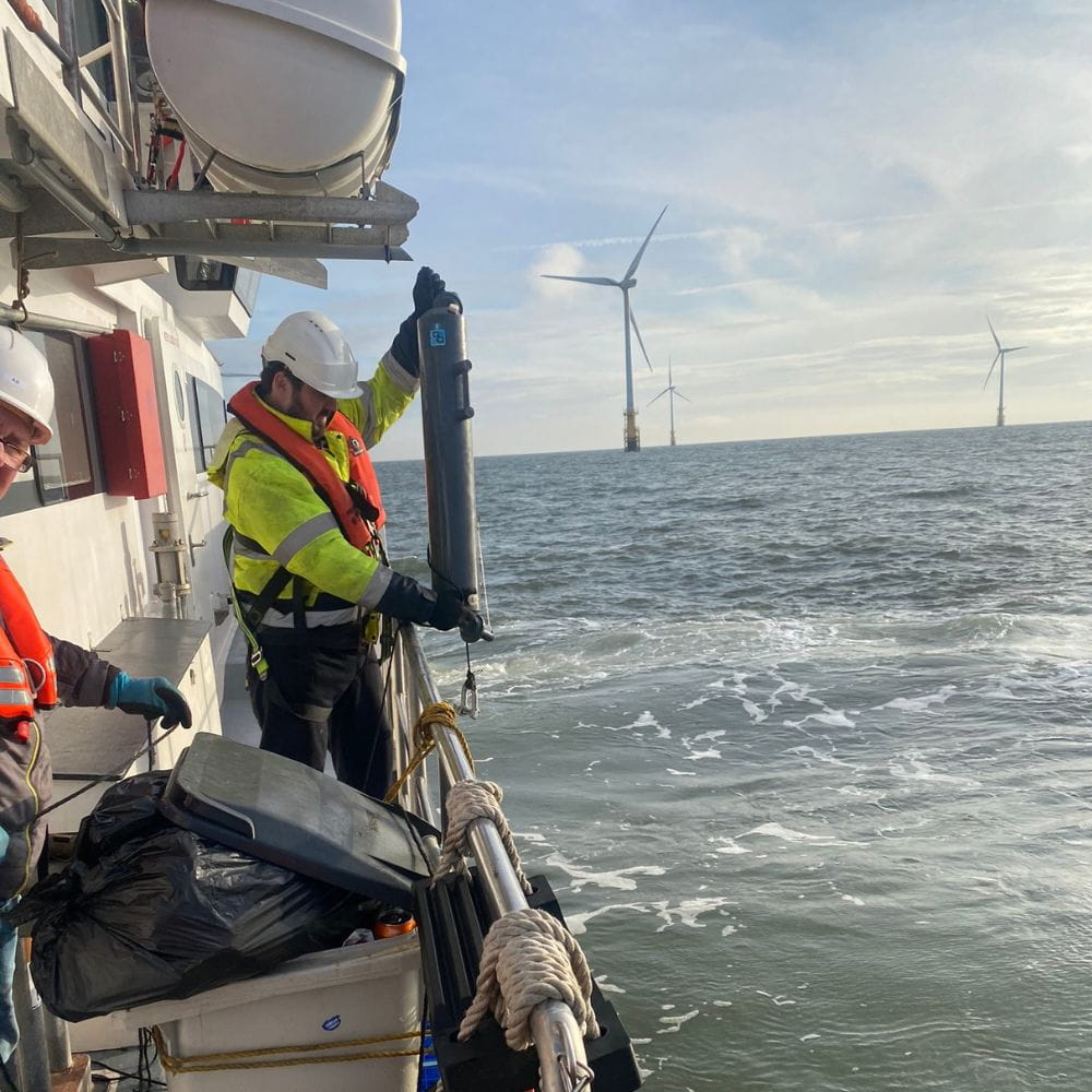 A researcher examines a sample by a turbine