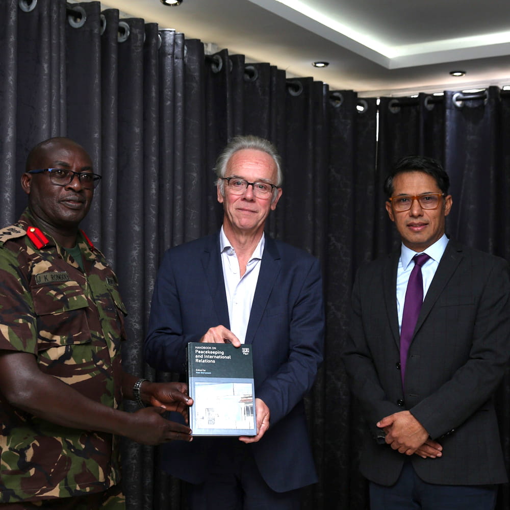 Commandant of the Humanitarian Peace Support School at the International Peace Support Training Centre, Col J K Rongoei with Professor Han Dorussen and Dr Prabin Khadka.  