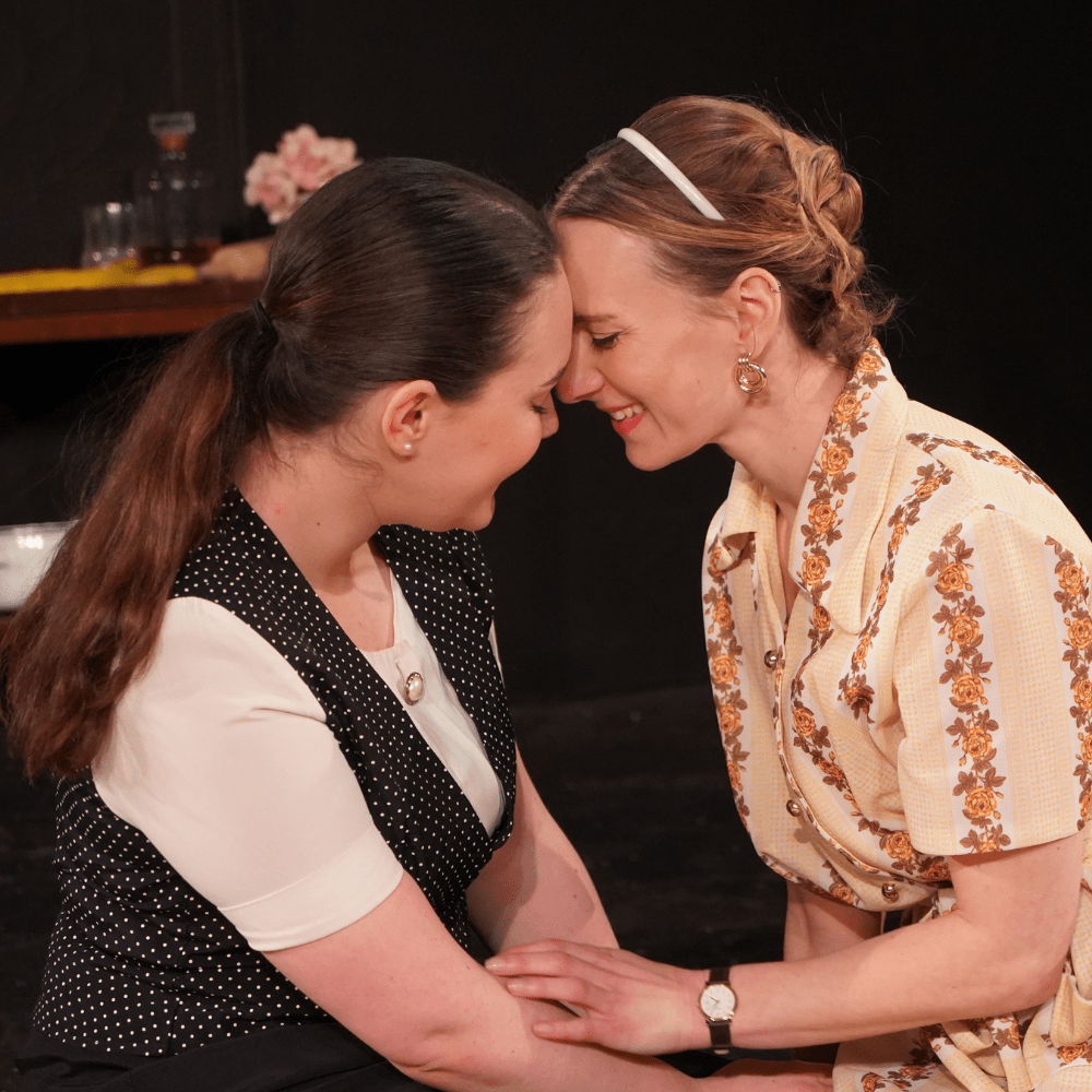 Lena Liedl and Faith McCune performing their play, The Good Women