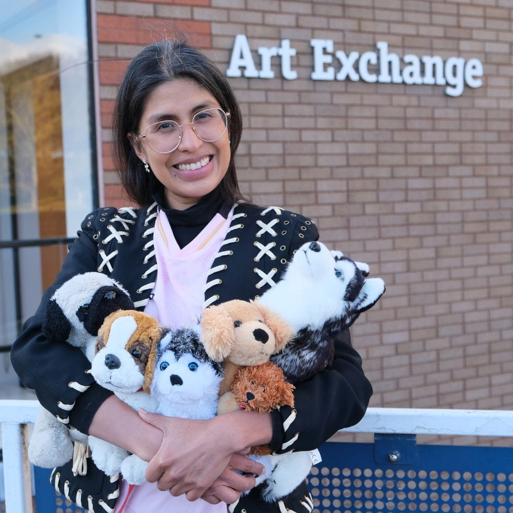 Assistant curator Gisselle Giron with plushies