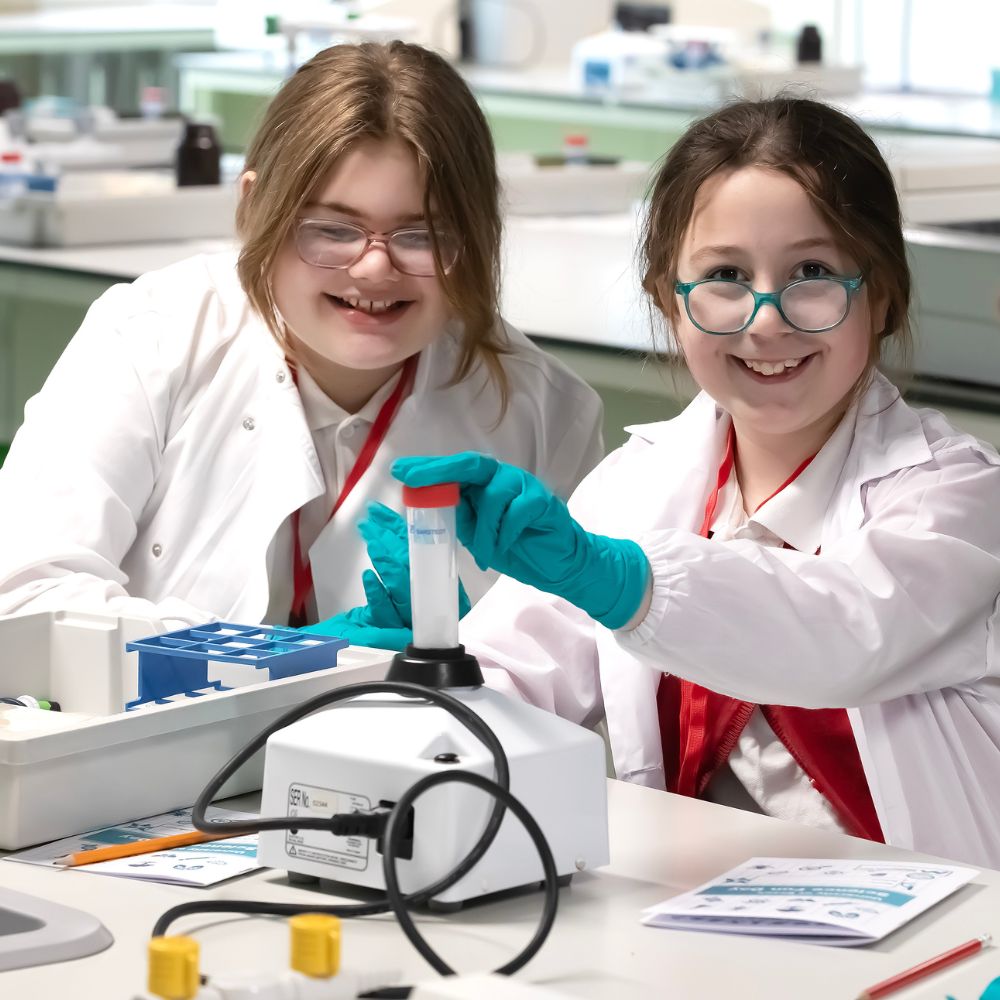 School pupils doing experiment as part of fun day
