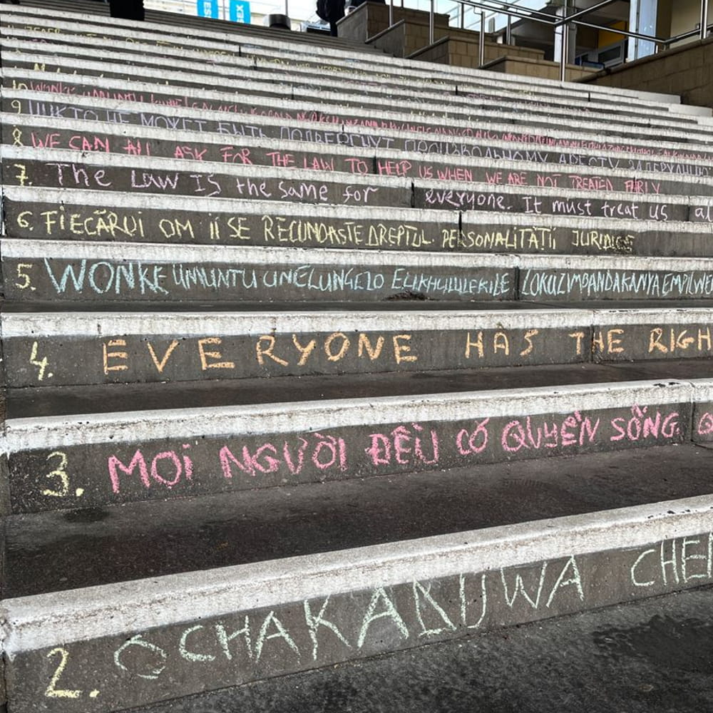 Steps on our Colchester Campus with the Universal Declaration of Human Rights chalked across them