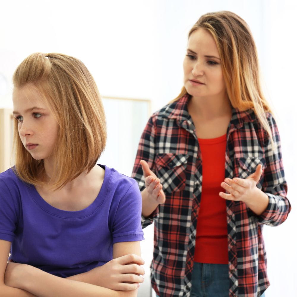 Daughter has turned her back on her mother who is talking to her