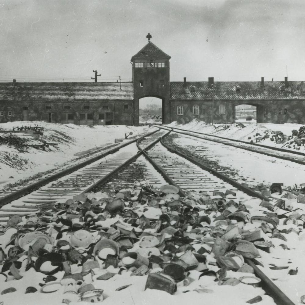 Auschwitz gates, courtesy of The Archive of the State Museum Auschwitz-Birkenau in Oświęcim