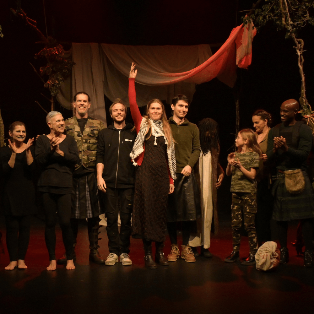 Dr Sofie Qwarnström (centre) taking the applause on stage