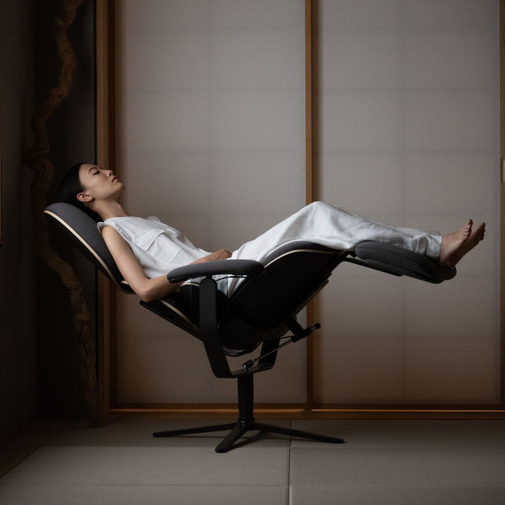A woman using the meditation chair 