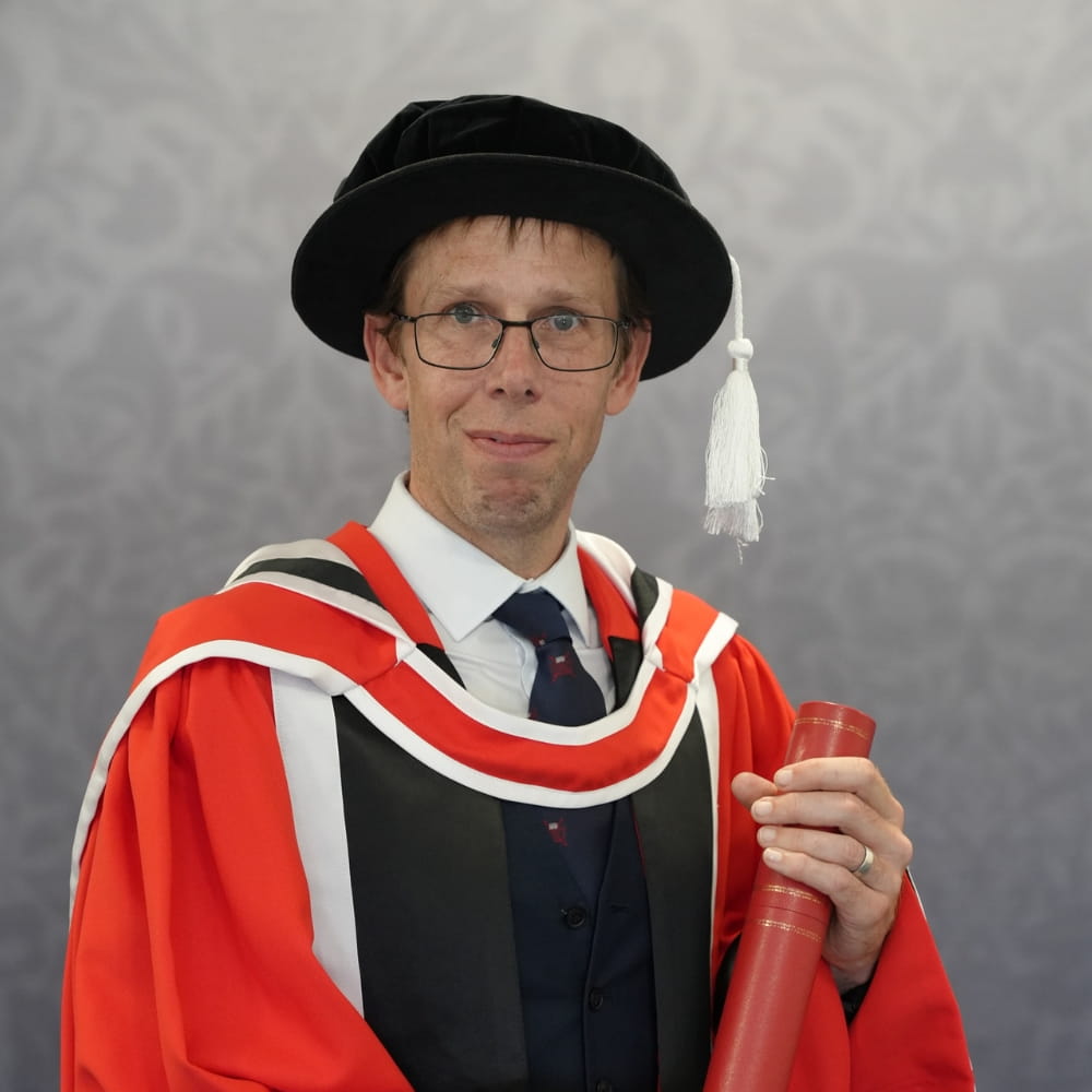 Honorary graduate Andrew Botham in his robes