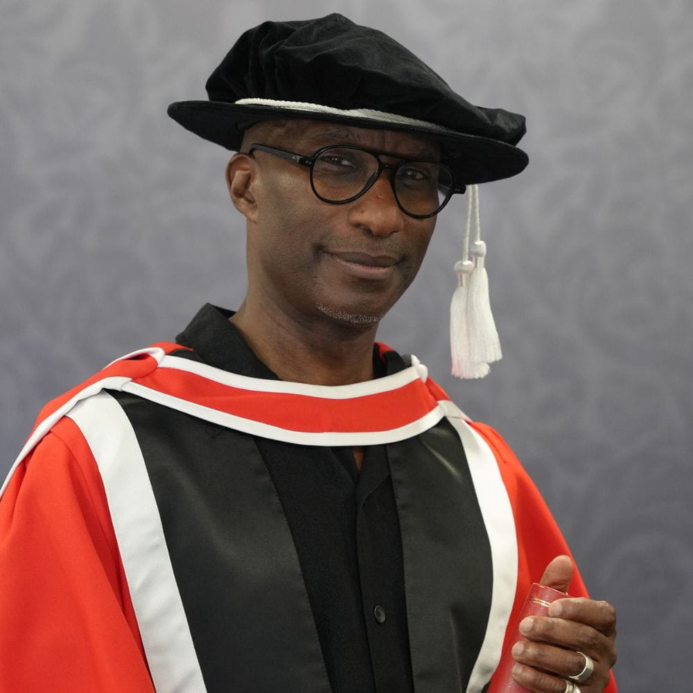 Clint Dyer in honorary graduate robes
