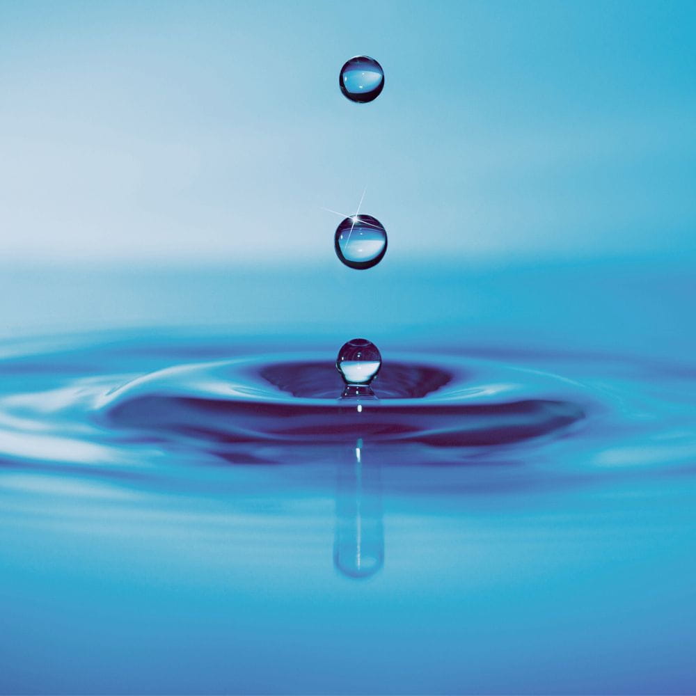 Drops falling onto a pool of water
