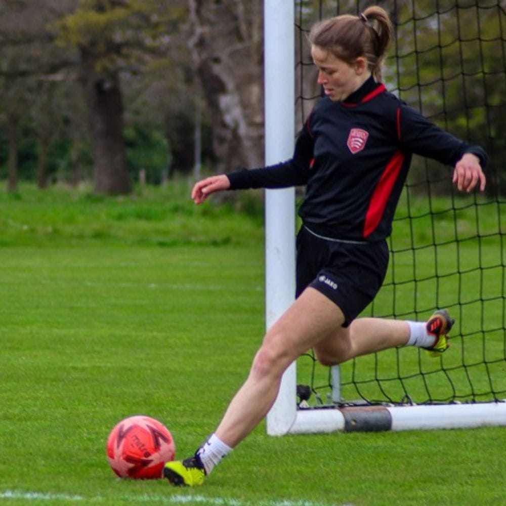 An Essex player kicks the ball