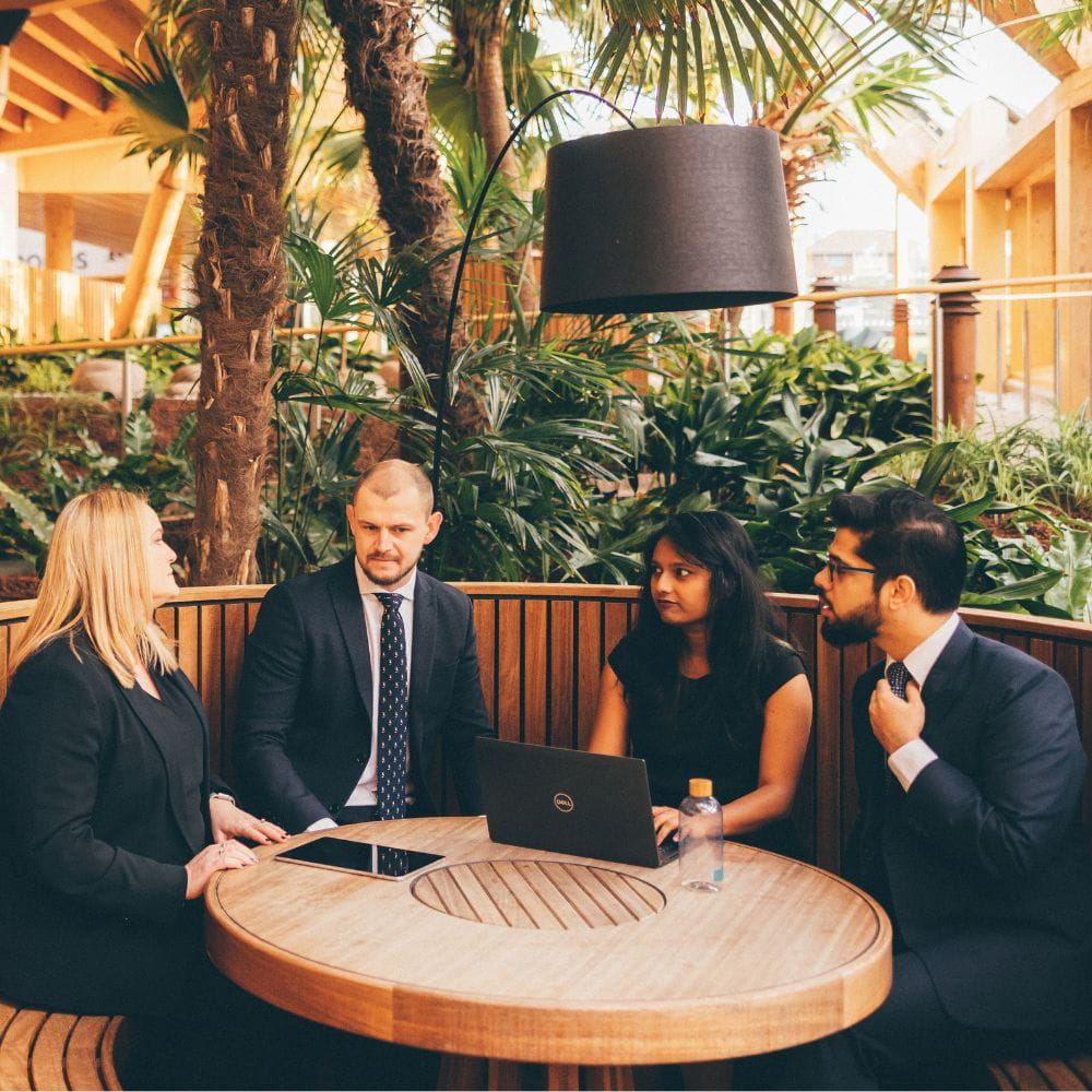 Business meeting around a table in Essex Business School