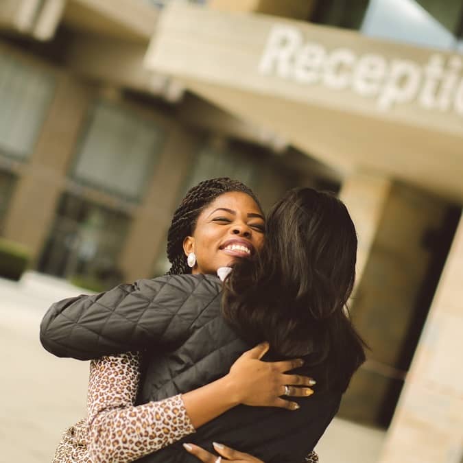 A parent hugging their child who applied through Clearing at the University of Essex.