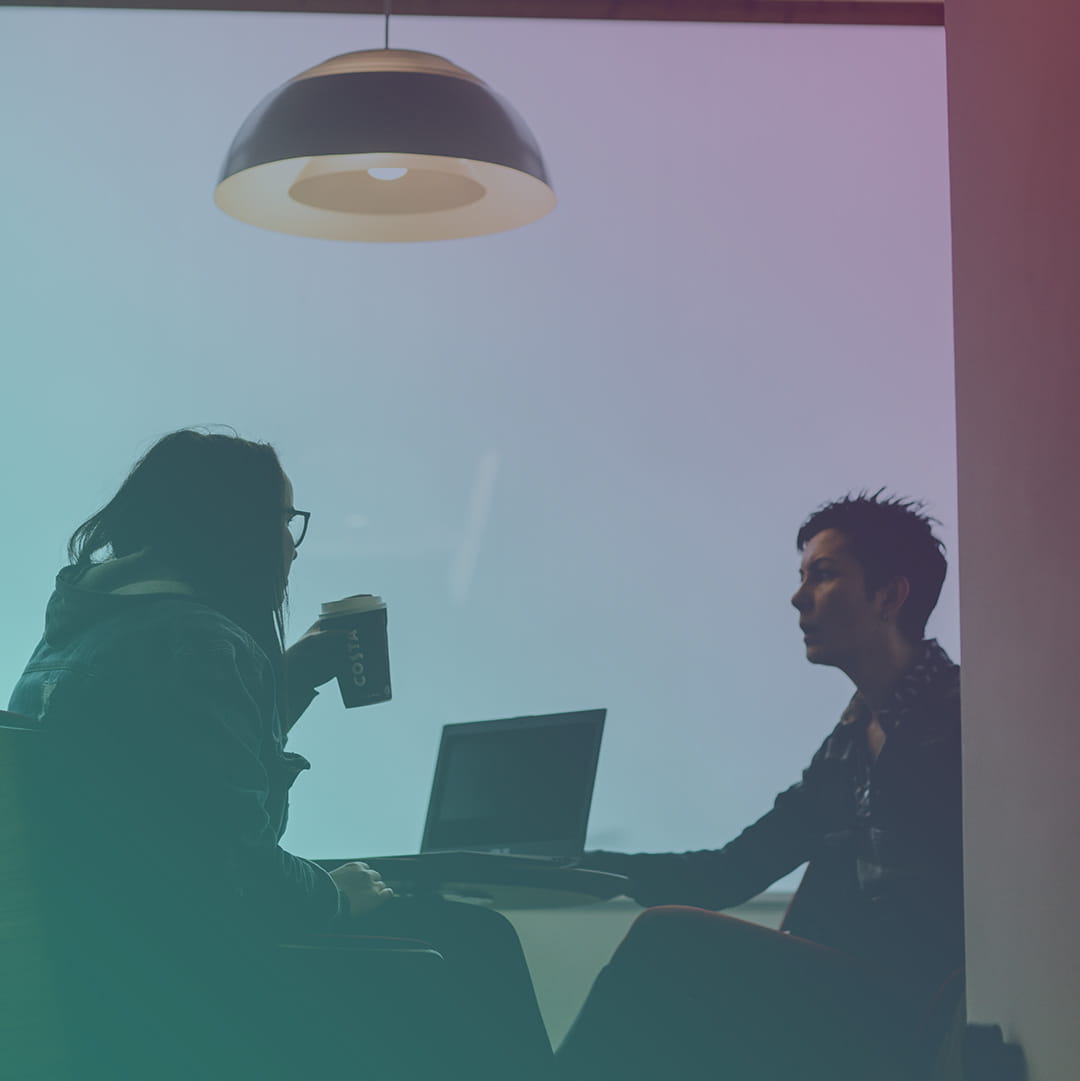 Two students chatting over coffee