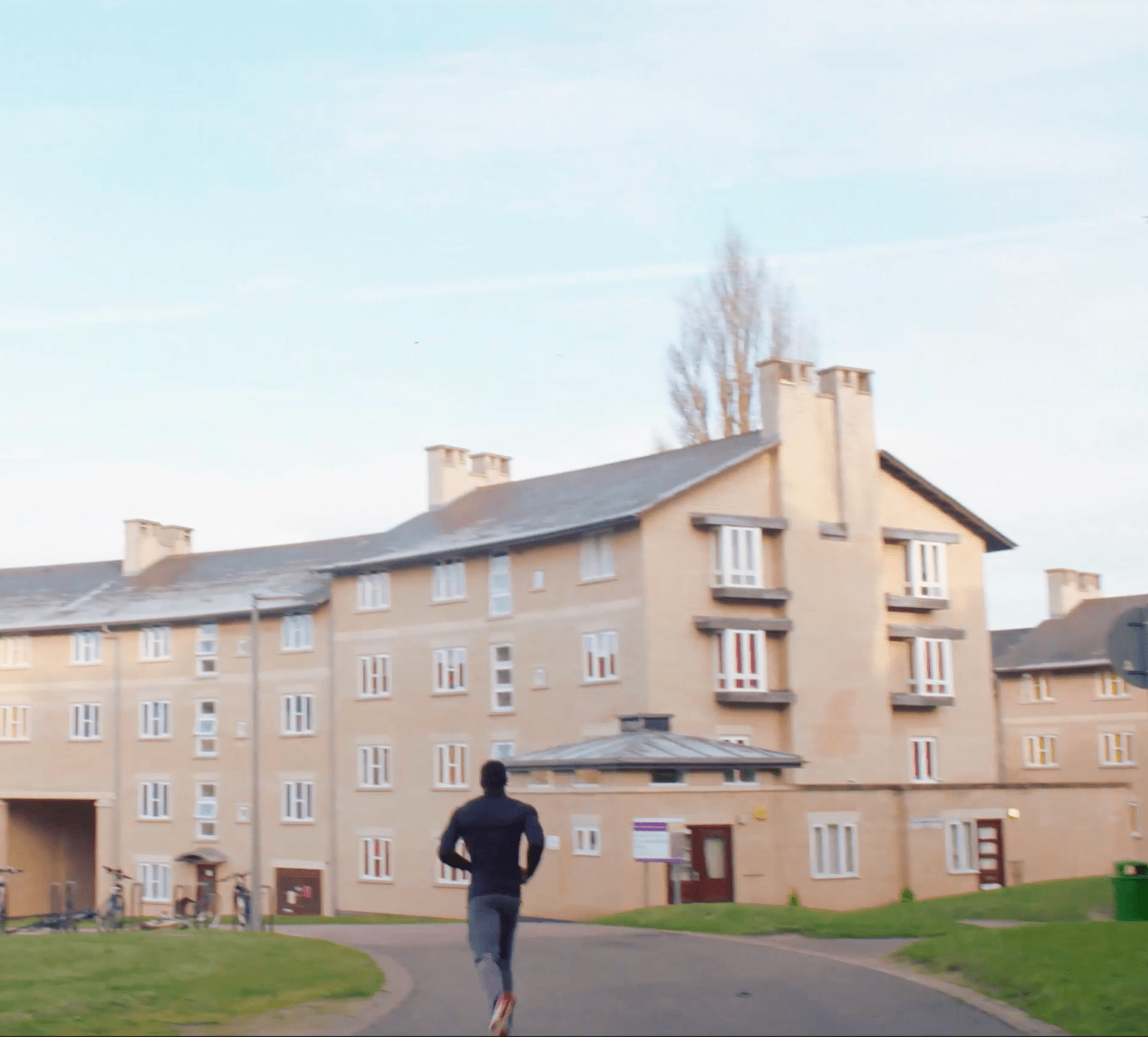 Student running through South Courts accommodation in Colchester