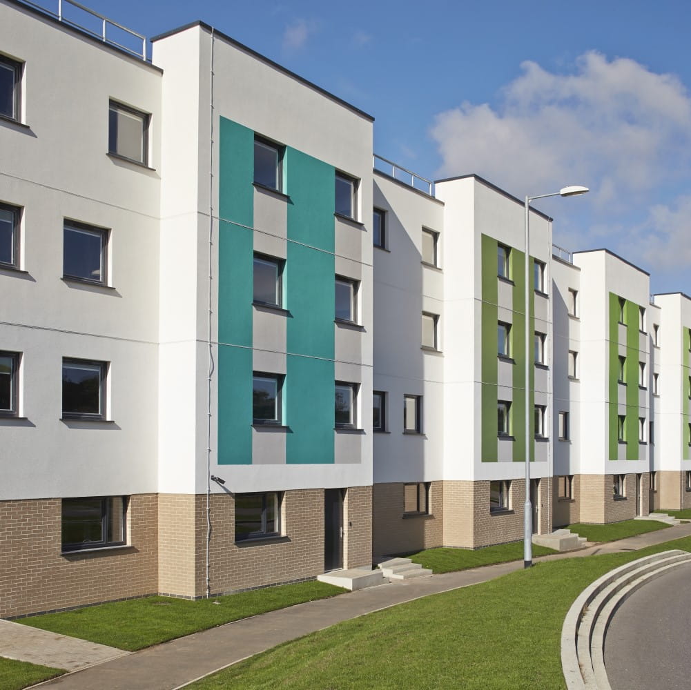 The meadows townhouses building with green panelling