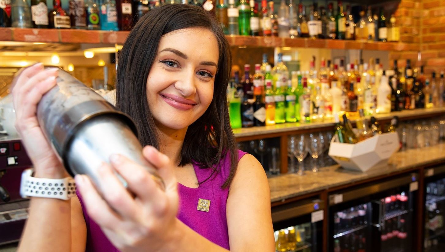 Brittany mixes a cocktail