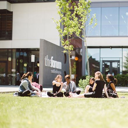 Students relaxing on a sunny day outside the Forum in Southend