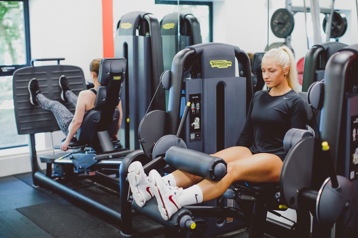 Woman on weight machine in Essex Sport Gym