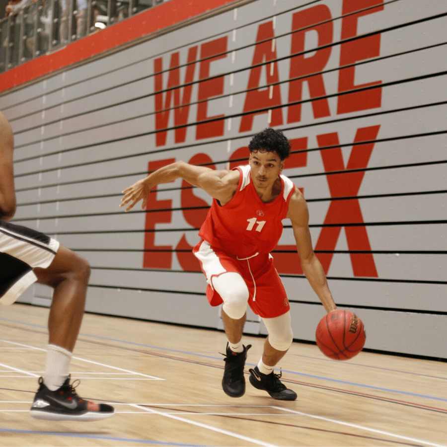 Male dribbling a basketball