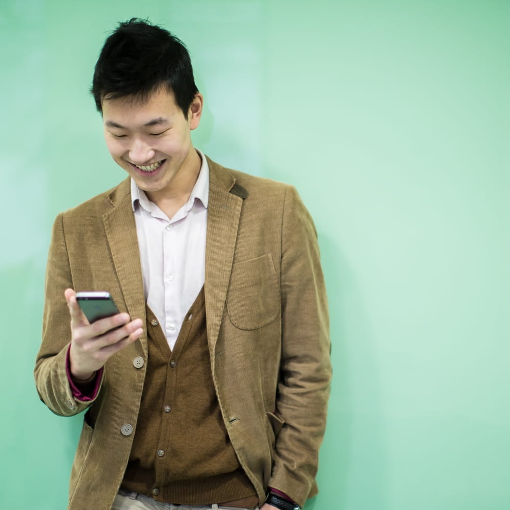 Student looking at his phone